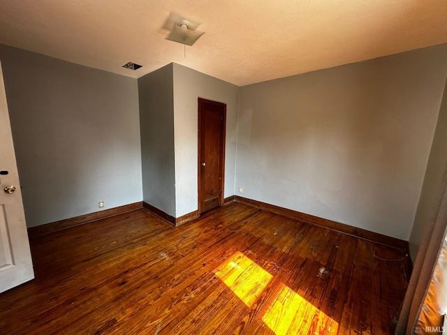 1114 W 4th St, Marion, IN 46952 - empty room featuring wood-type flooring and baseboards