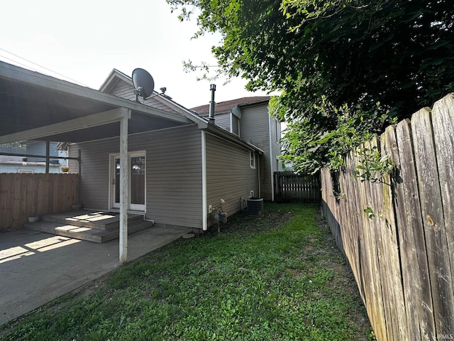1114 W 4th St, Marion, IN 46952 - rear view of house featuring a fenced backyard and a patio