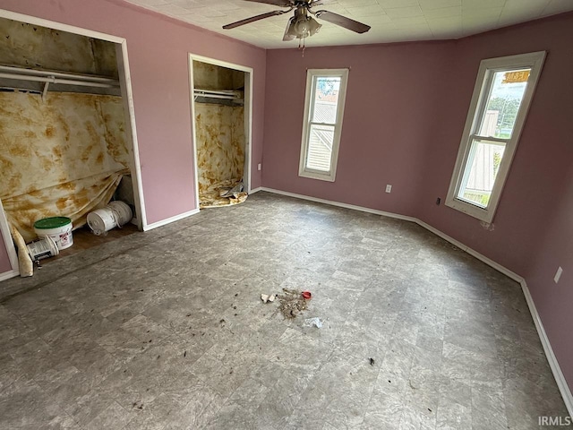 313 N Embree St, Princeton, IN 47670 - unfurnished bedroom with multiple closets and ceiling fan