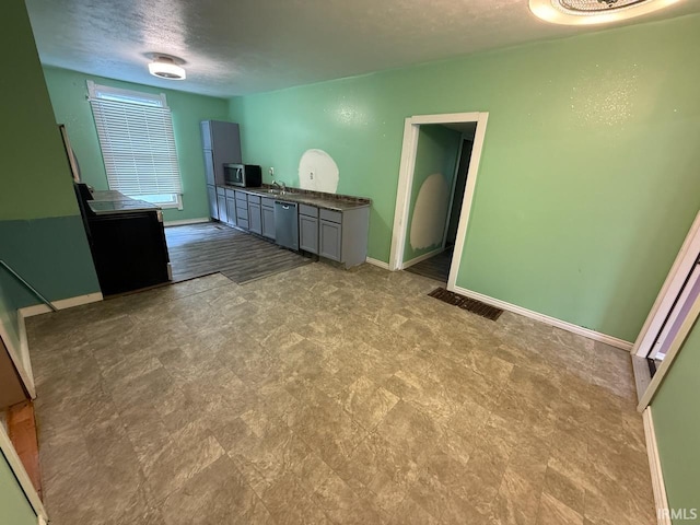 313 N Embree St, Princeton, IN 47670 - empty room with tile patterned floors and a textured ceiling