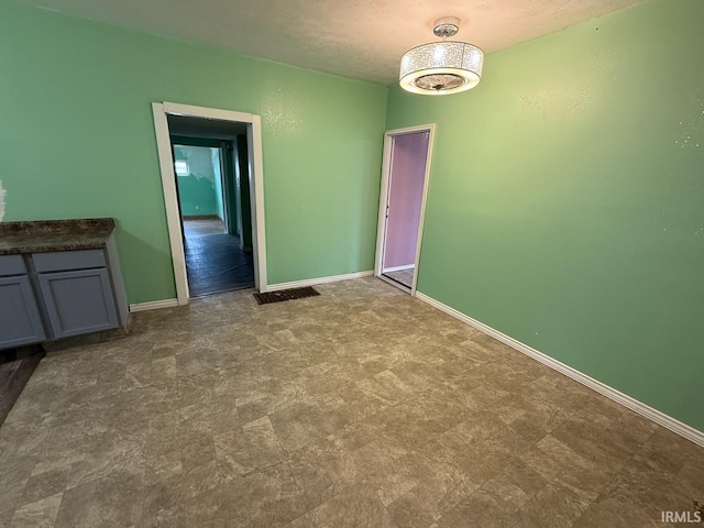 313 N Embree St, Princeton, IN 47670 - unfurnished dining area with baseboards