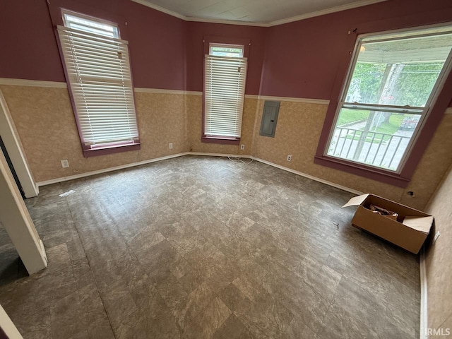 313 N Embree St, Princeton, IN 47670 - spare room featuring electric panel, tile patterned floors, crown molding, and wainscoting