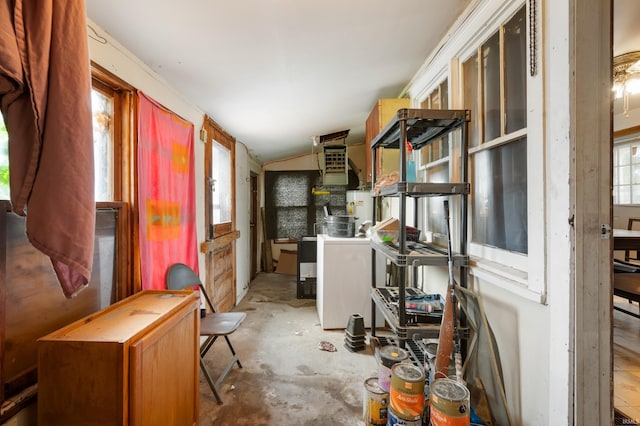 1614 E 24th St, Muncie, IN 47302 - kitchen with vaulted ceiling, concrete floors, and washer / dryer