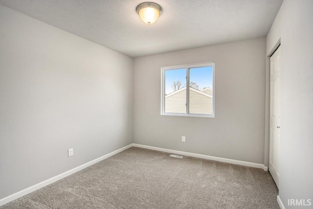 5116 Bankside Ct, Mishawaka, IN 46544 - carpeted spare room featuring baseboards and a textured ceiling