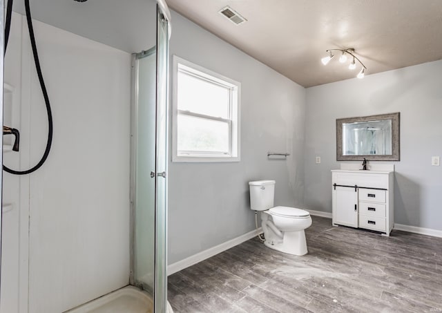 1000 N 500 E, Anderson, IN 46012 - full bath with vanity, a shower stall, and wood finished floors