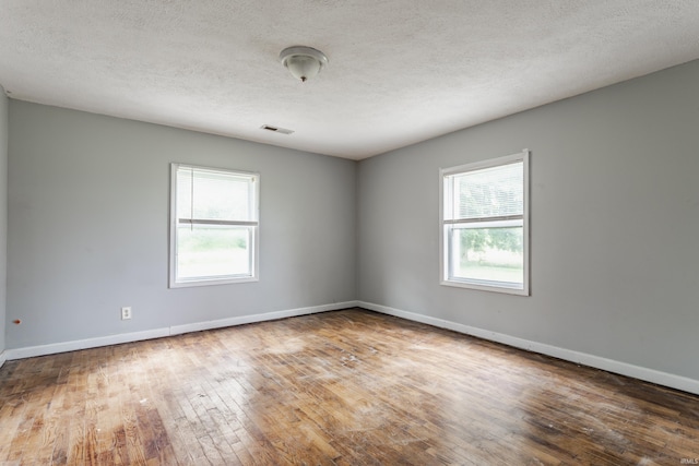 1000 N 500 E, Anderson, IN 46012 - spare room with hardwood / wood-style flooring and a textured ceiling