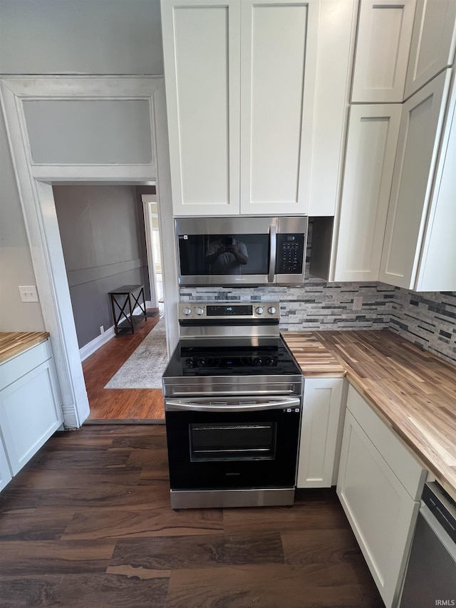 1906 N 15th St, Lafayette, IN 47904 - kitchen featuring butcher block counters, stainless steel appliances, dark wood-style floors, and white cabinets