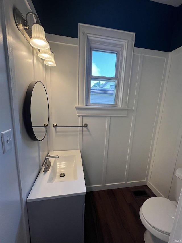 1906 N 15th St, Lafayette, IN 47904 - bathroom featuring vanity, wood finished floors, and a decorative wall