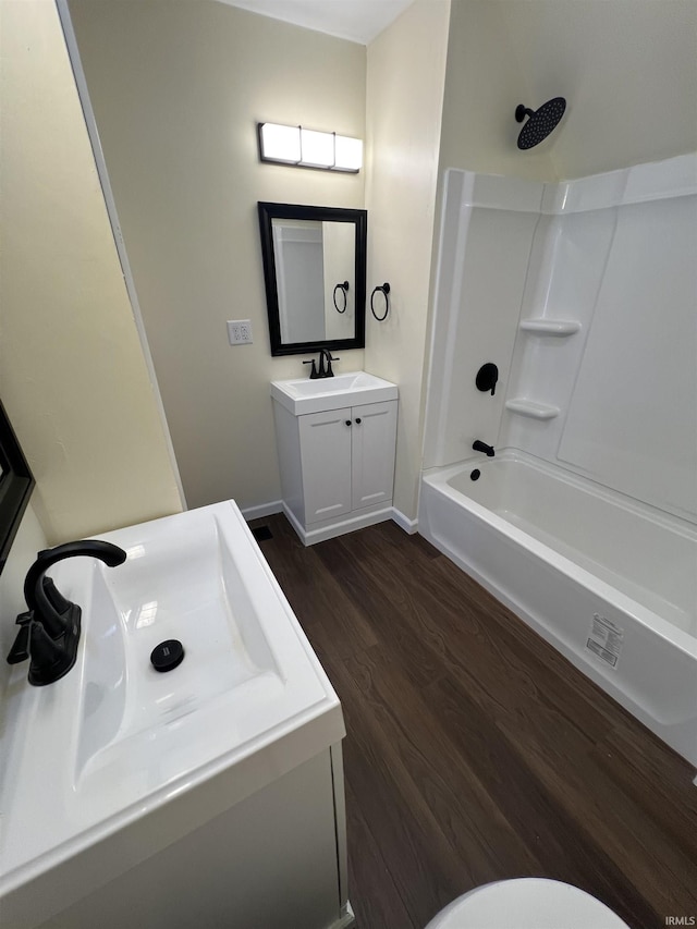 1906 N 15th St, Lafayette, IN 47904 - bathroom featuring vanity, wood finished floors, and tub / shower combination