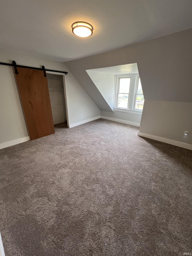 1906 N 15th St, Lafayette, IN 47904 - bonus room with lofted ceiling, carpet, and a barn door