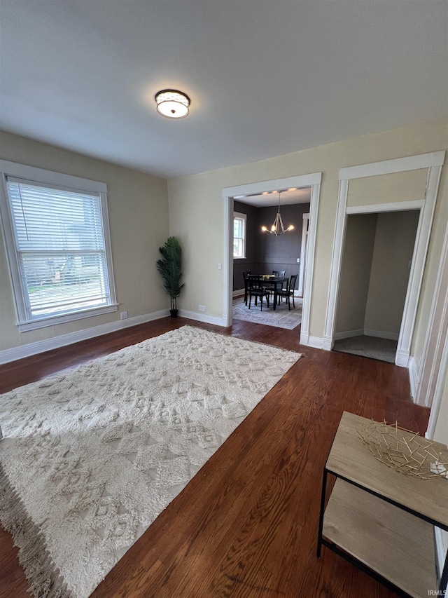 1906 N 15th St, Lafayette, IN 47904 - empty room with a chandelier and dark wood finished floors