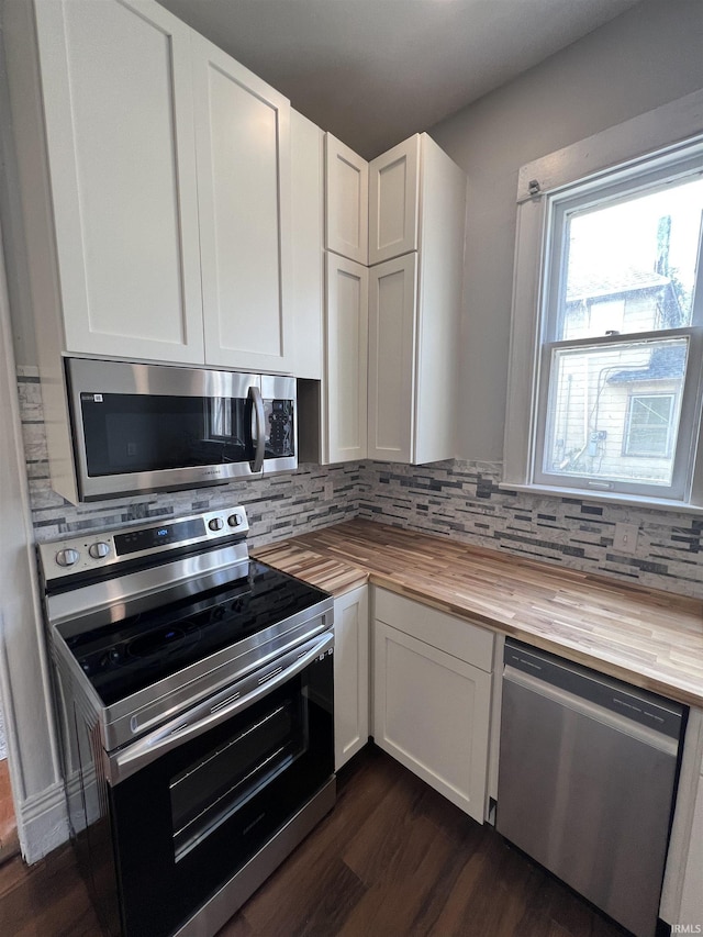 1906 N 15th St, Lafayette, IN 47904 - kitchen with wooden counters, appliances with stainless steel finishes, backsplash, and dark wood-style flooring