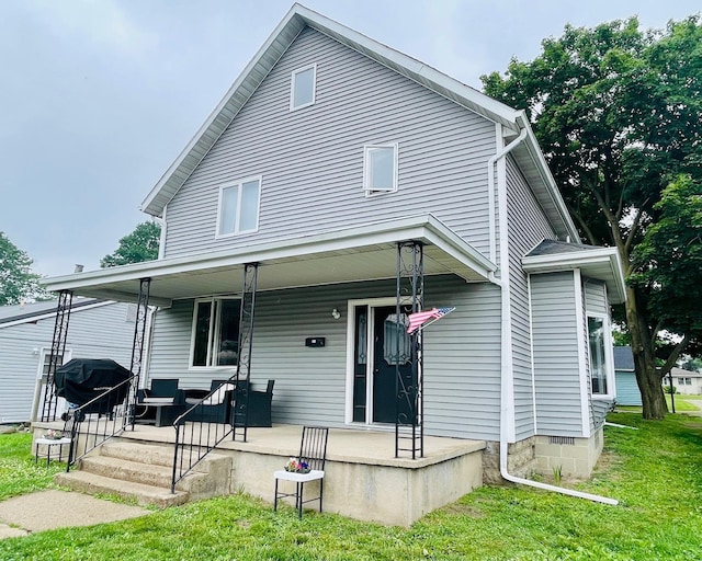 125 Shalley Dr, Plymouth, IN 46563 - view of front of home with a porch and a front lawn