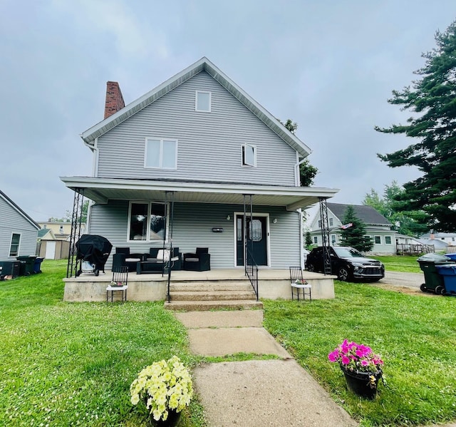 125 Shalley Dr, Plymouth, IN 46563 - view of front of property featuring a chimney, a front lawn, and a porch