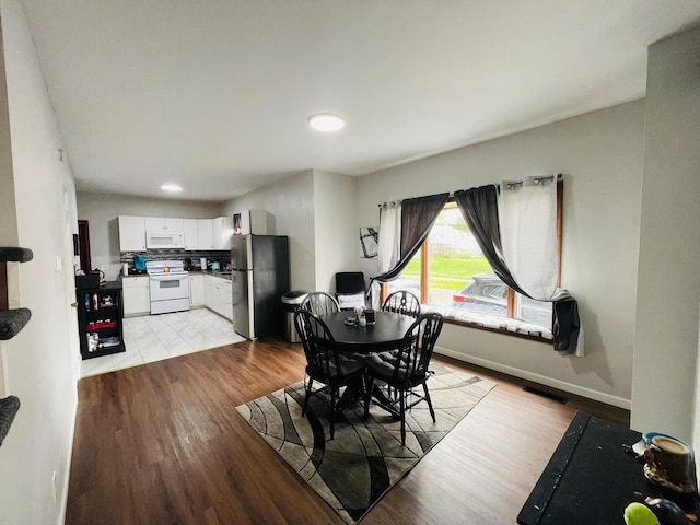 125 Shalley Dr, Plymouth, IN 46563 - dining room with light wood finished floors and recessed lighting