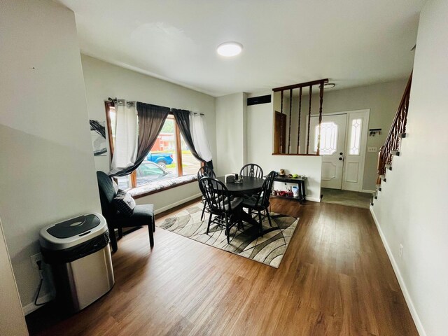 125 Shalley Dr, Plymouth, IN 46563 - dining space featuring wood finished floors and stairs