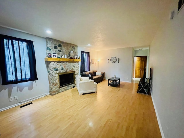 125 Shalley Dr, Plymouth, IN 46563 - living area with wood finished floors, a fireplace, and recessed lighting