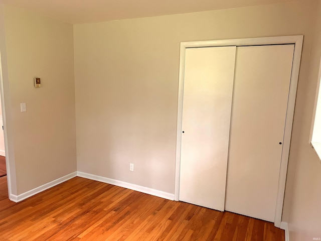 758 W 400 S Rd, Wabash, IN 46992 - unfurnished bedroom with light wood-style flooring and a closet