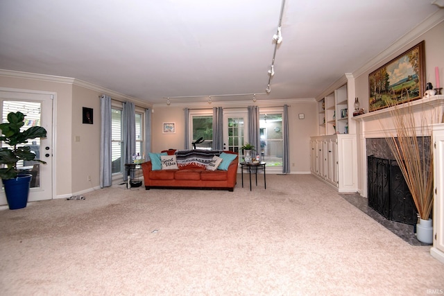 631 W 8th St, Bicknell, IN 47512 - living area with track lighting, light colored carpet, crown molding, and a premium fireplace