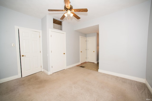 631 W 8th St, Bicknell, IN 47512 - unfurnished bedroom featuring carpet and ceiling fan