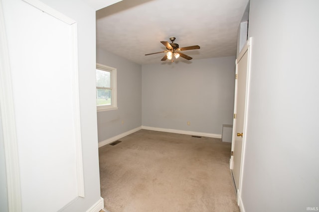 631 W 8th St, Bicknell, IN 47512 - spare room with a ceiling fan and light colored carpet