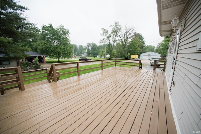 631 W 8th St, Bicknell, IN 47512 - wooden deck featuring an outdoor structure and view of scattered trees