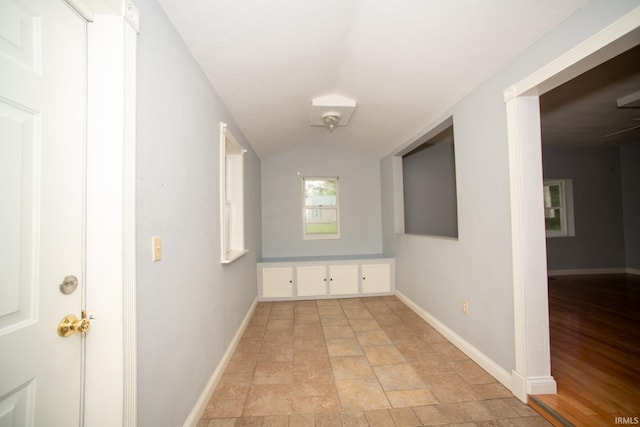 631 W 8th St, Bicknell, IN 47512 - corridor with vaulted ceiling and light stone finish floors