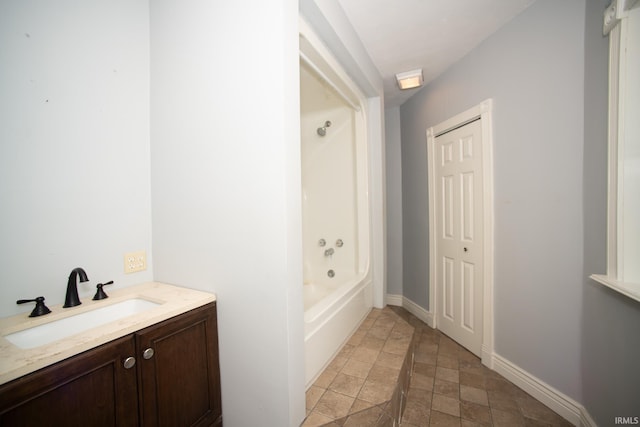 631 W 8th St, Bicknell, IN 47512 - full bathroom with stone finish flooring, vanity, and shower / bathtub combination