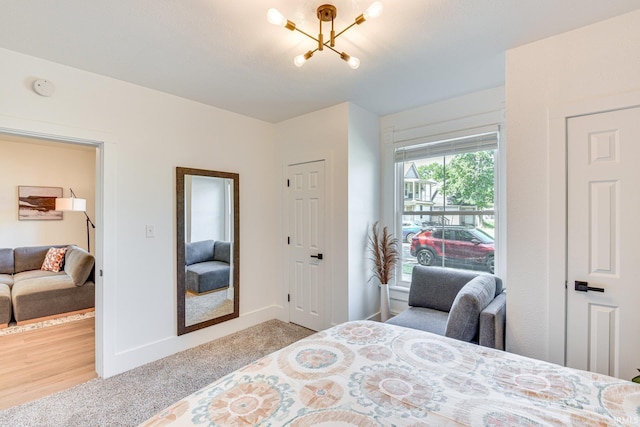 516 W Navarre St, South Bend, IN 46616 - bedroom with a chandelier and carpet flooring