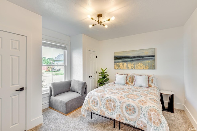 516 W Navarre St, South Bend, IN 46616 - carpeted bedroom featuring a chandelier and baseboards