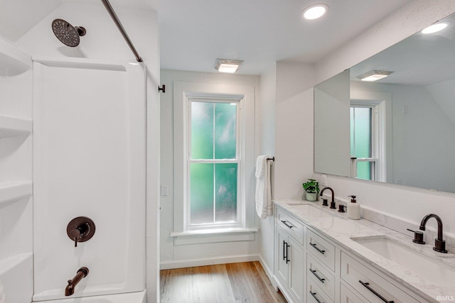516 W Navarre St, South Bend, IN 46616 - full bath with double vanity, wood finished floors, and healthy amount of natural light