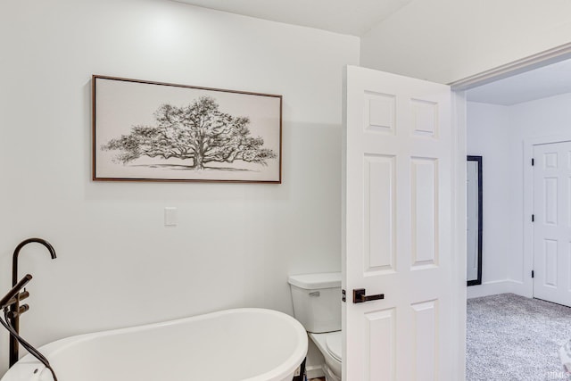 516 W Navarre St, South Bend, IN 46616 - bathroom featuring toilet and a freestanding tub