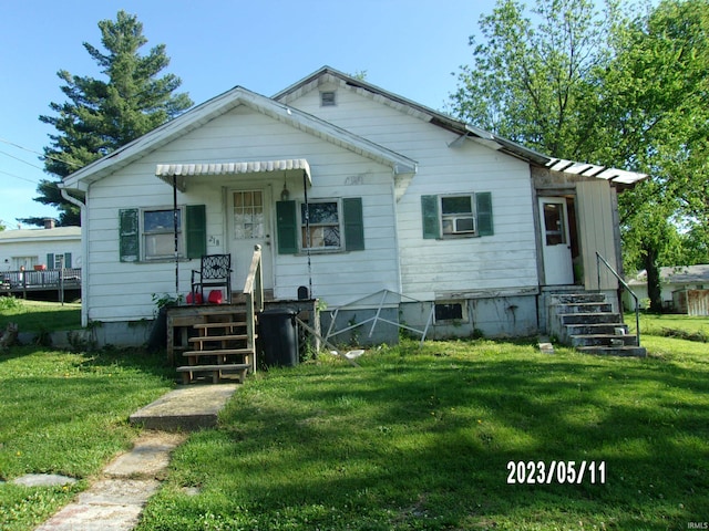 218 W Ave Rd, Paoli, IN 47454 - bungalow-style home with a front lawn