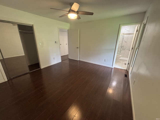 1821 E Johnson Ln, Vincennes, IN 47591 - unfurnished bedroom featuring dark wood-type flooring, connected bathroom, a ceiling fan, and a closet