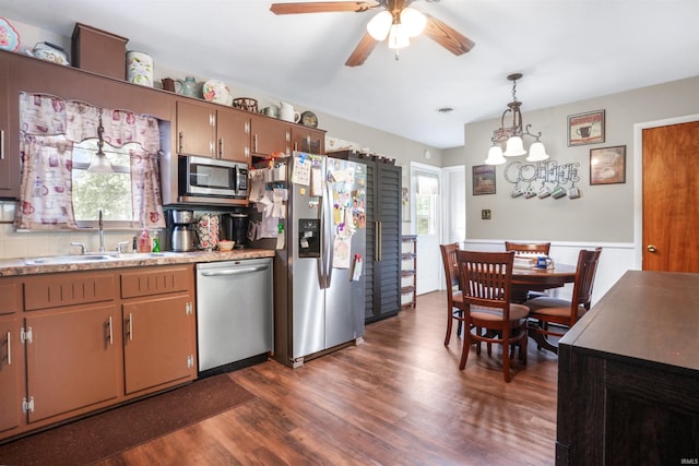 2208 Franklin St, Tell City, IN 47586 - kitchen with stainless steel appliances, dark wood-type flooring, ceiling fan, light countertops, and hanging light fixtures