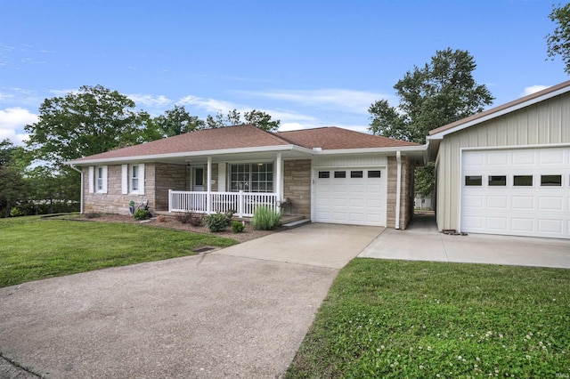 2208 Franklin St, Tell City, IN 47586 - single story home with covered porch, stone siding, concrete driveway, and a garage