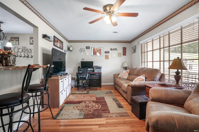 2208 Franklin St, Tell City, IN 47586 - living area featuring a desk, light wood finished floors, ceiling fan, and ornamental molding
