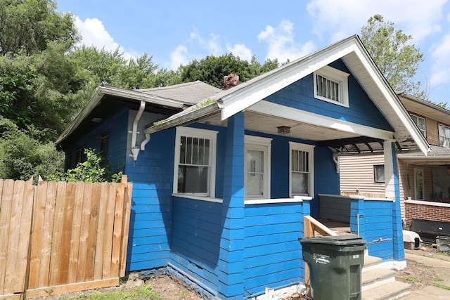 901 Lawndale Ave, South Bend, IN 46628 - view of front facade featuring covered porch and a chimney