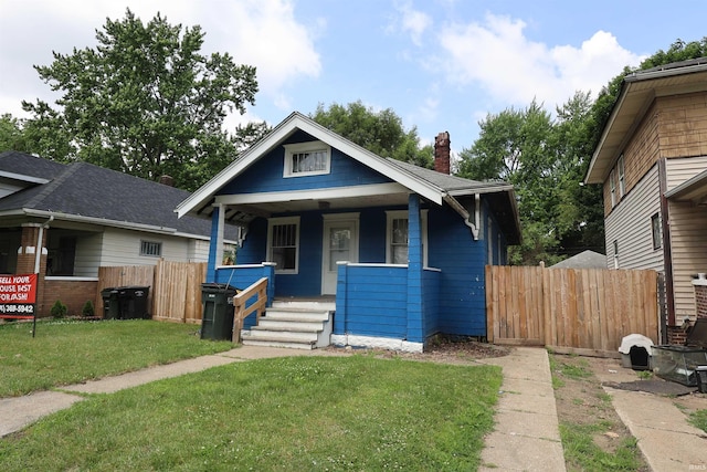 901 Lawndale Ave, South Bend, IN 46628 - bungalow-style home with a porch and a chimney