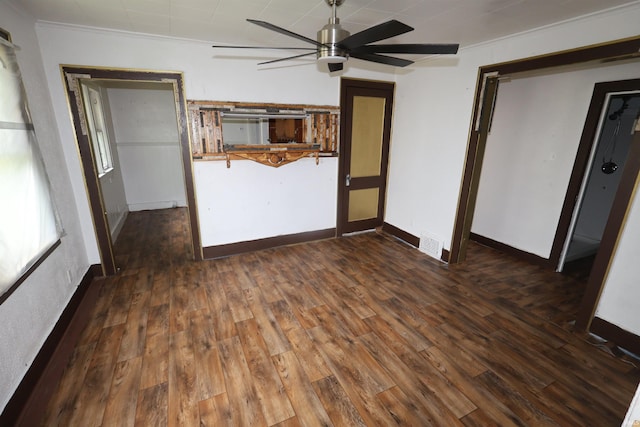 901 Lawndale Ave, South Bend, IN 46628 - unfurnished living room with a ceiling fan, wood finished floors, and crown molding