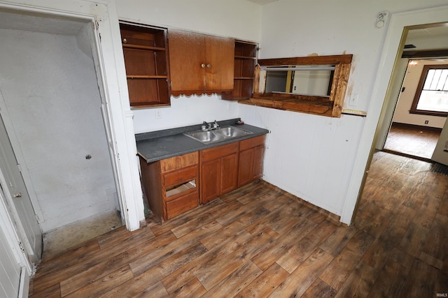 901 Lawndale Ave, South Bend, IN 46628 - kitchen featuring open shelves, dark wood-style flooring, brown cabinets, and dark countertops