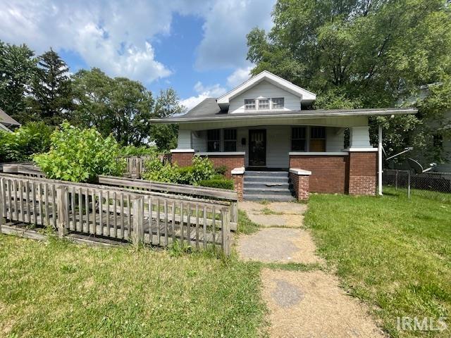 758 N Olive St, South Bend, IN 46628 - bungalow featuring covered porch and brick siding