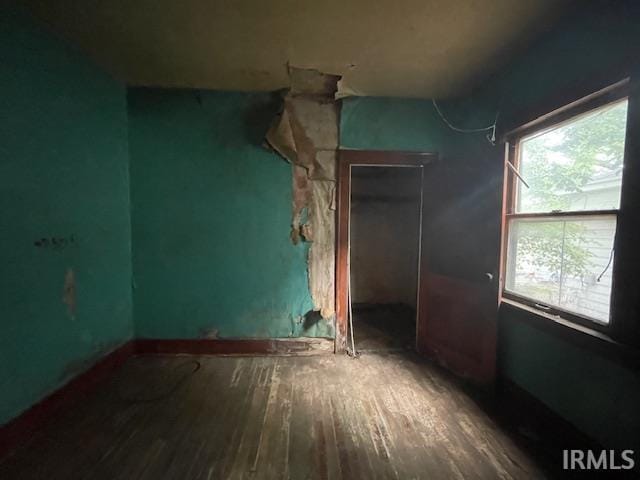 758 N Olive St, South Bend, IN 46628 - unfurnished bedroom featuring hardwood / wood-style floors and a closet
