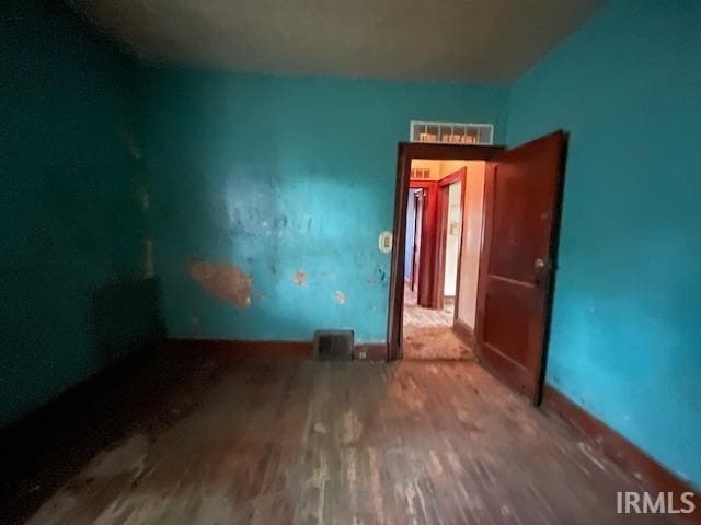 758 N Olive St, South Bend, IN 46628 - spare room featuring wood finished floors
