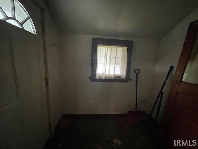 758 N Olive St, South Bend, IN 46628 - empty room featuring plenty of natural light and vaulted ceiling