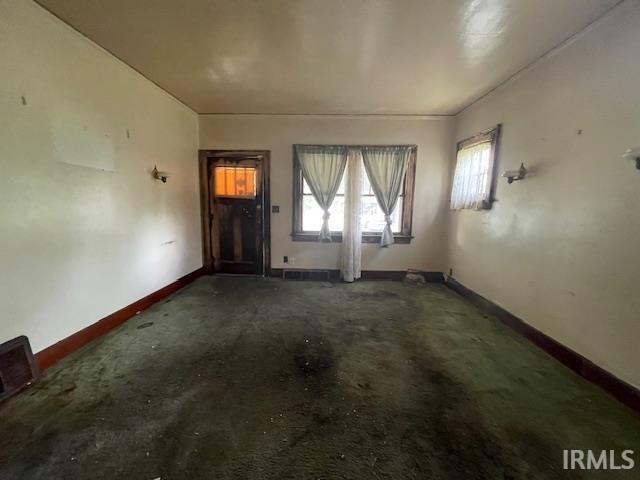 758 N Olive St, South Bend, IN 46628 - entrance foyer featuring baseboards and carpet floors