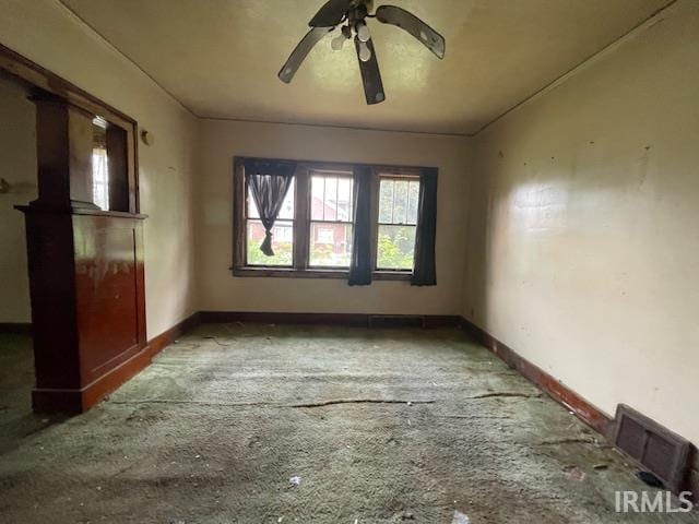 758 N Olive St, South Bend, IN 46628 - spare room featuring a ceiling fan and baseboards
