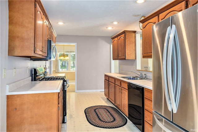 13920 Lexington Cir, Granger, IN 46530 - kitchen with appliances with stainless steel finishes, brown cabinetry, light countertops, recessed lighting, and light flooring