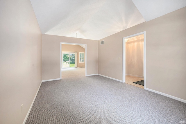13920 Lexington Cir, Granger, IN 46530 - spare room featuring light carpet and vaulted ceiling