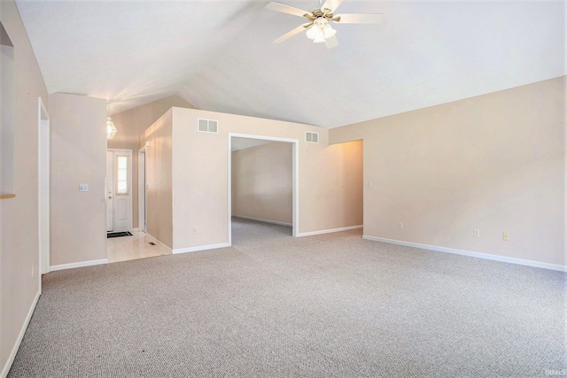 13920 Lexington Cir, Granger, IN 46530 - spare room with light carpet, ceiling fan, and vaulted ceiling